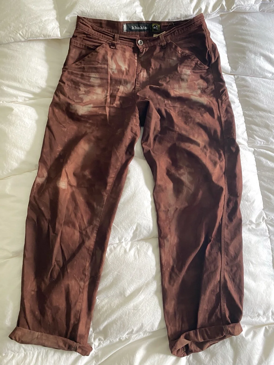 Burgundy dyed trousers, full garment shown