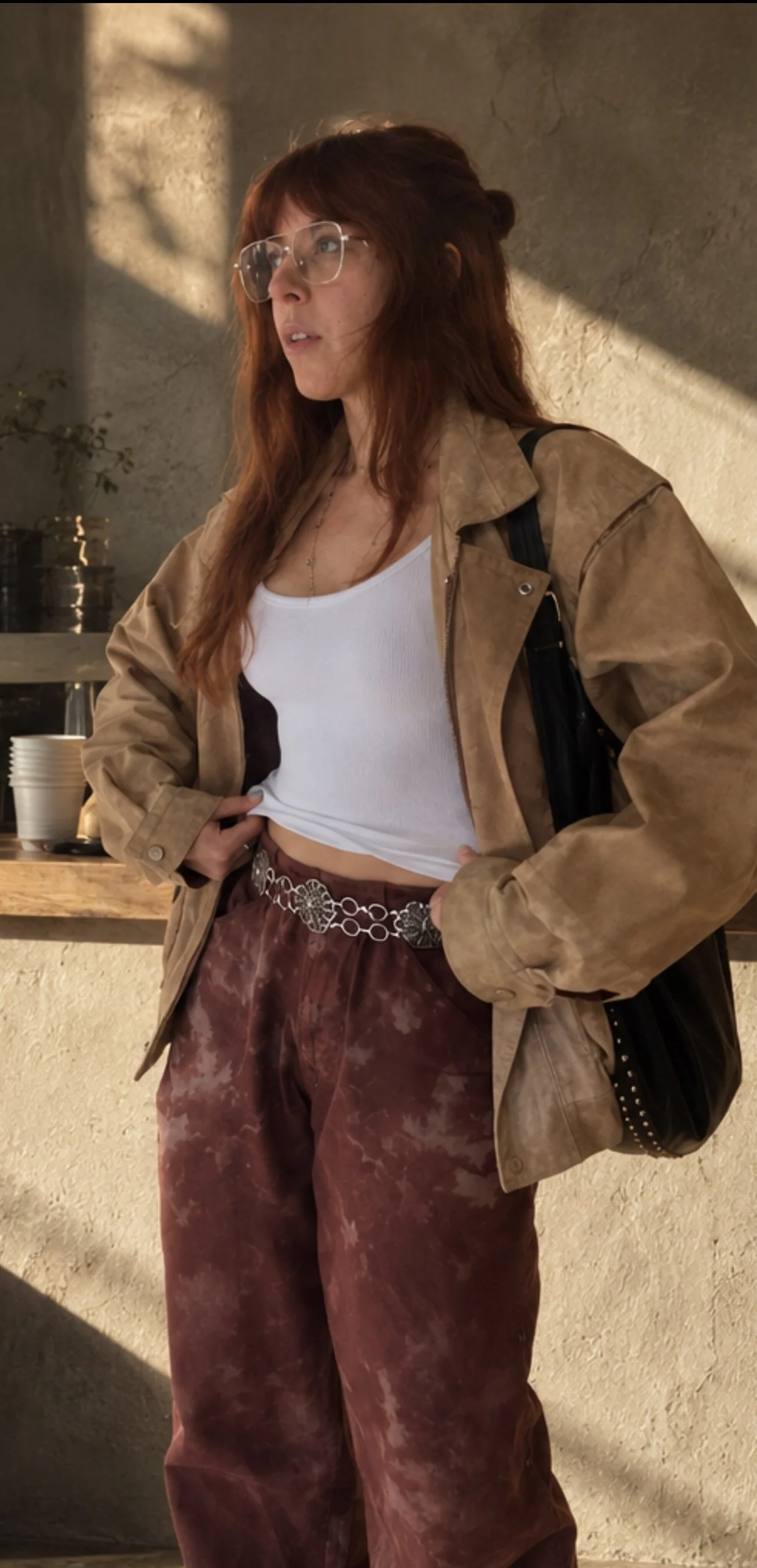 Styled view of burgundy dyed trousers