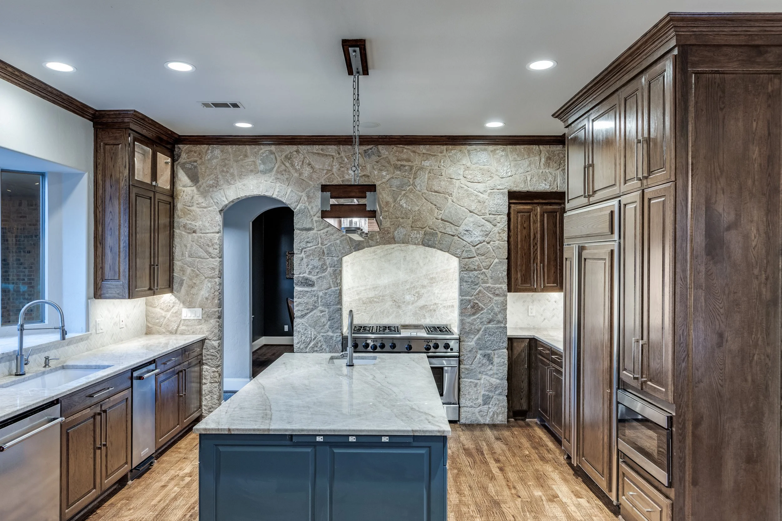 Quartzite backsplash, new Vent-A-Hood.