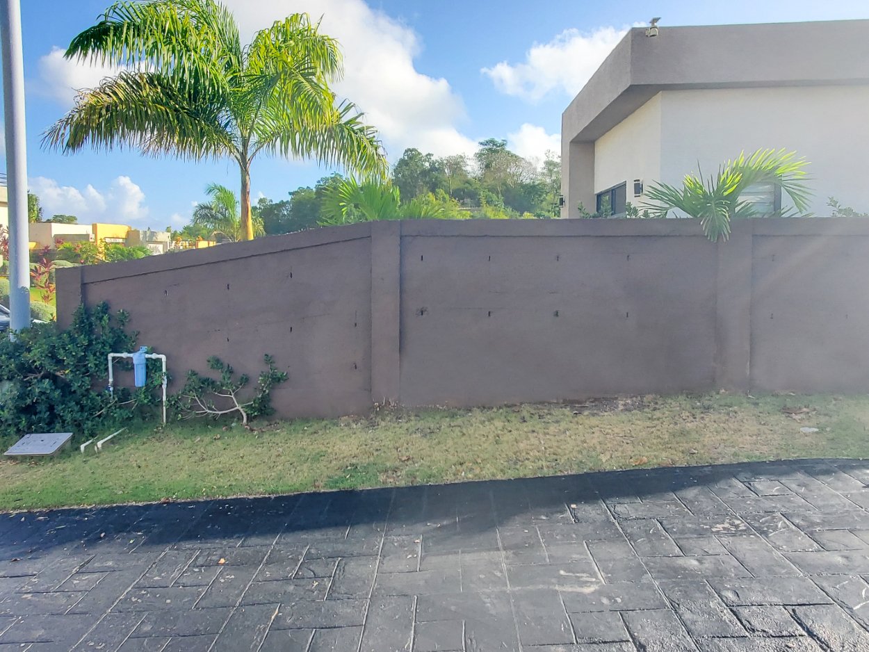 Before picture of landscape design area with unhealthy grass with no plants or shrubs