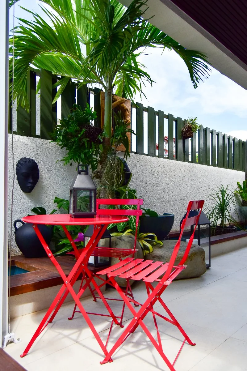 modern-tropical-patio-red-bistro-set-koi-pond-design-ocho-rios-jamaica.jpg