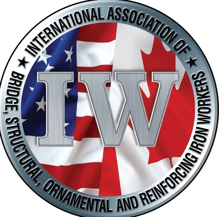 Emblem of the International Association of Bridge, Structural, Ornamental, and Reinforcing Iron Workers, featuring an American flag and a Canadian flag behind a large 'IW' logo.