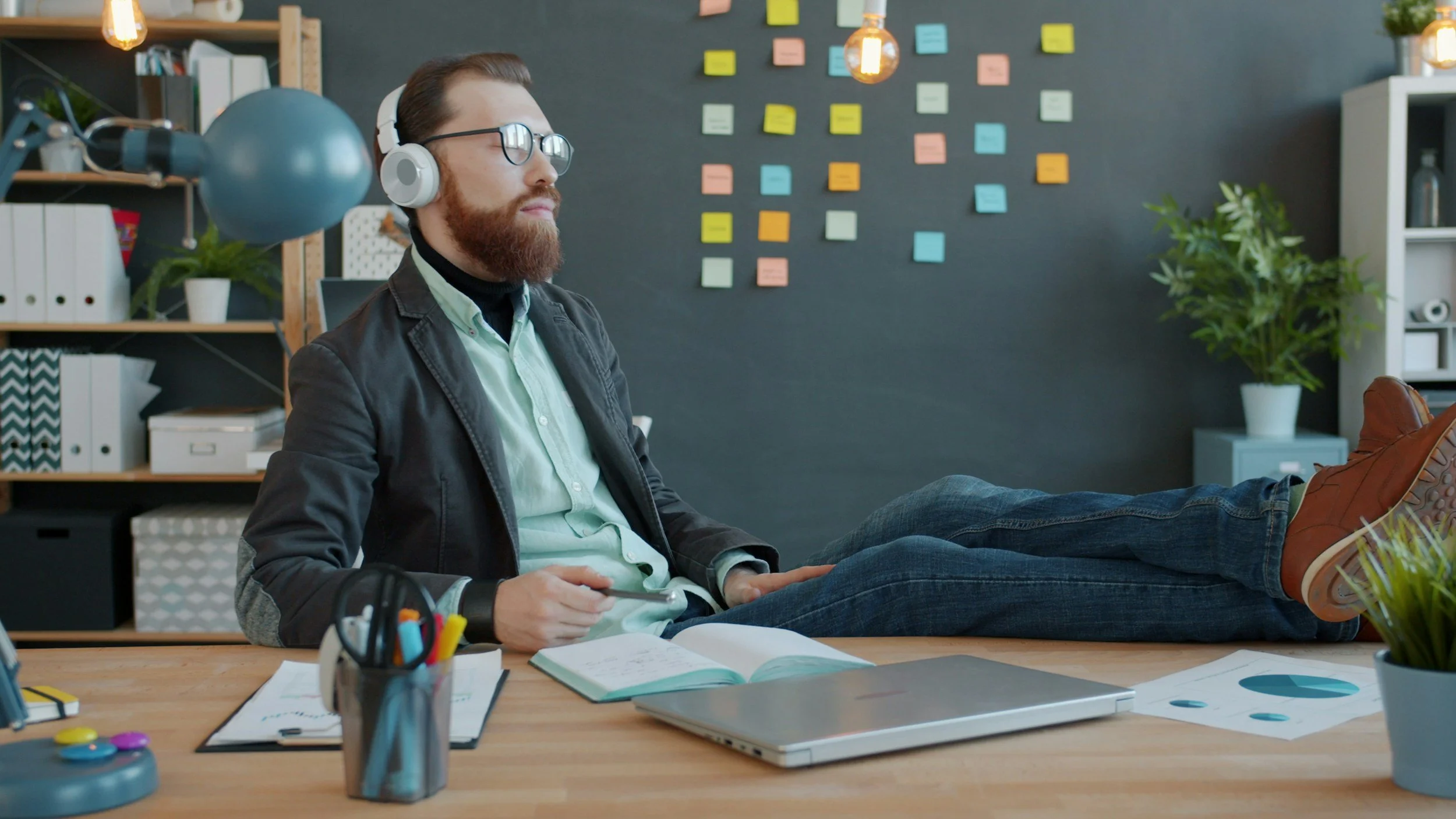 A calendar with red checkmarks on various dates next to a smartphone displaying an acoustic guitar.