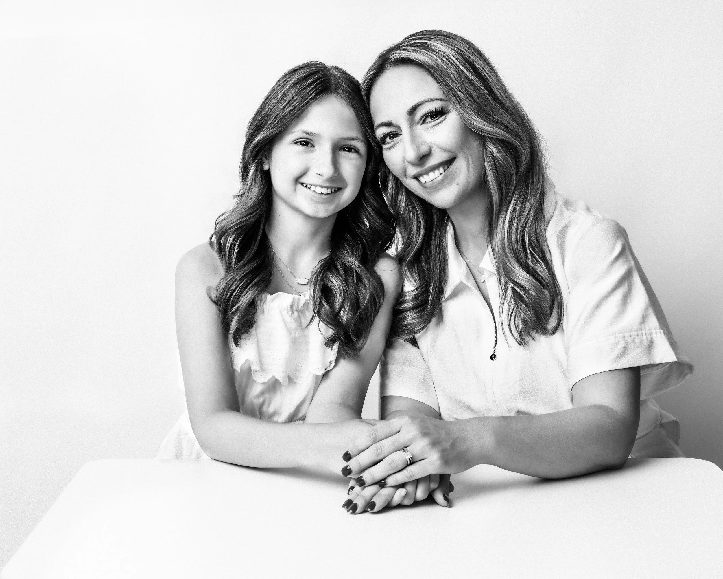 Orlando mother and daughter portrait photography featuring a timeless black-and-white studio portrait by Agata Powers Photography.
