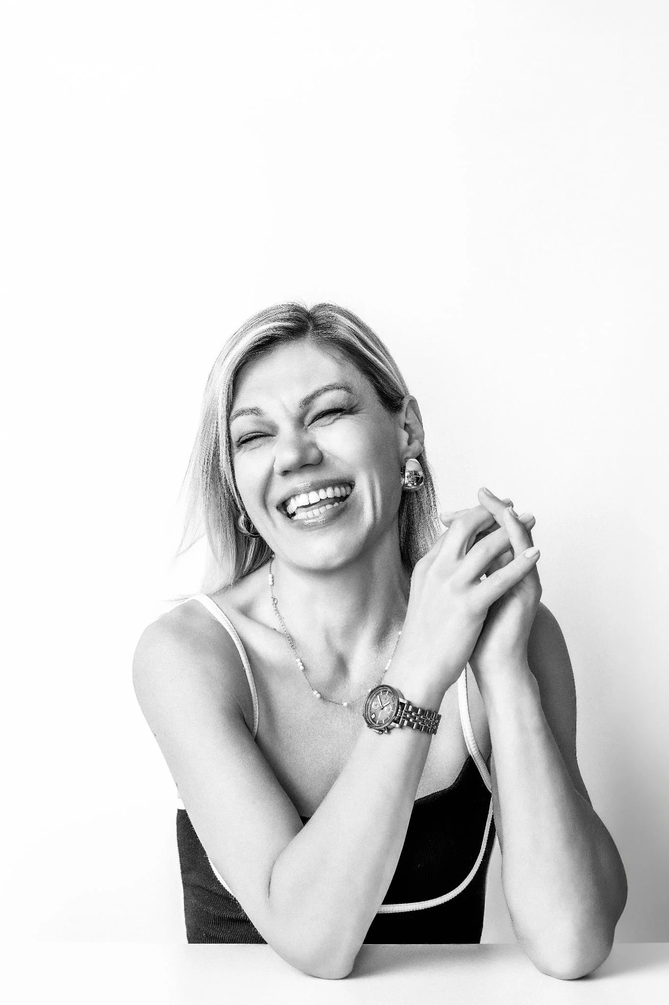 Fun and playful black-and-white portrait of a woman laughing, photographed by Orlando women’s portrait photographer Agata Powers Photography.
