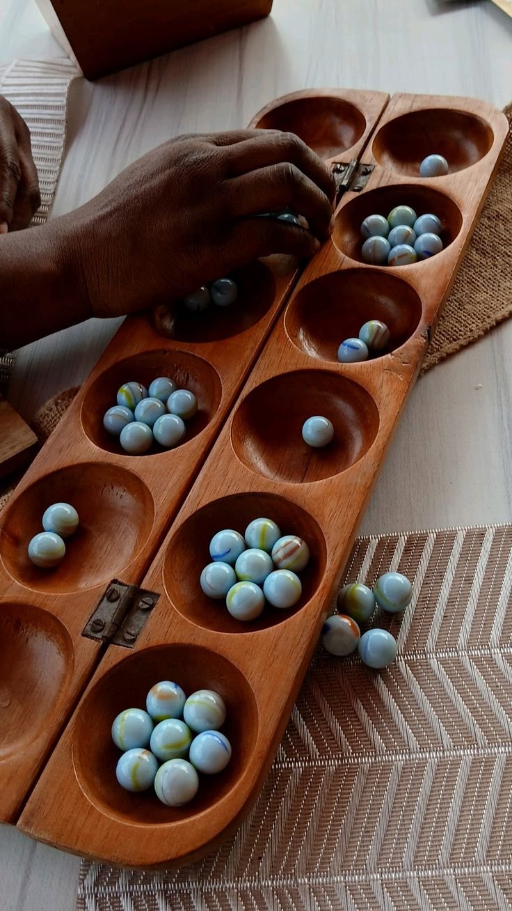 from the oware boards originating in Ghana, to the dominoes tables spotted across Washington Heights and throughout the Caribbean, to the spades table at family reunions across the country- games have been a central part of the art of gathering and c