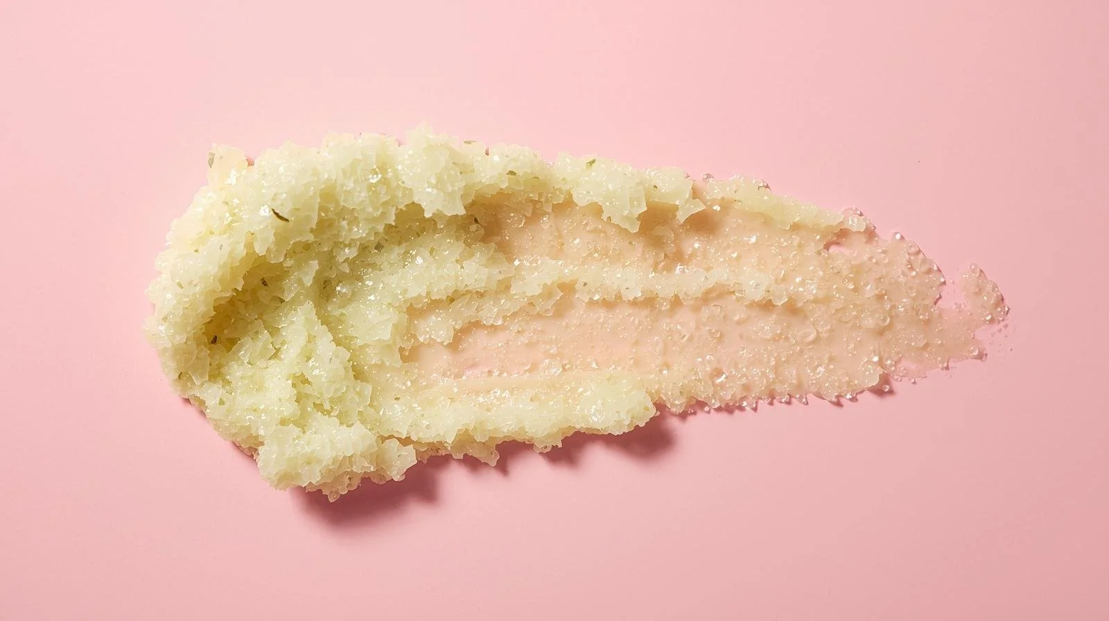 light green apple sage sugar scrub smeared pink background.jpg