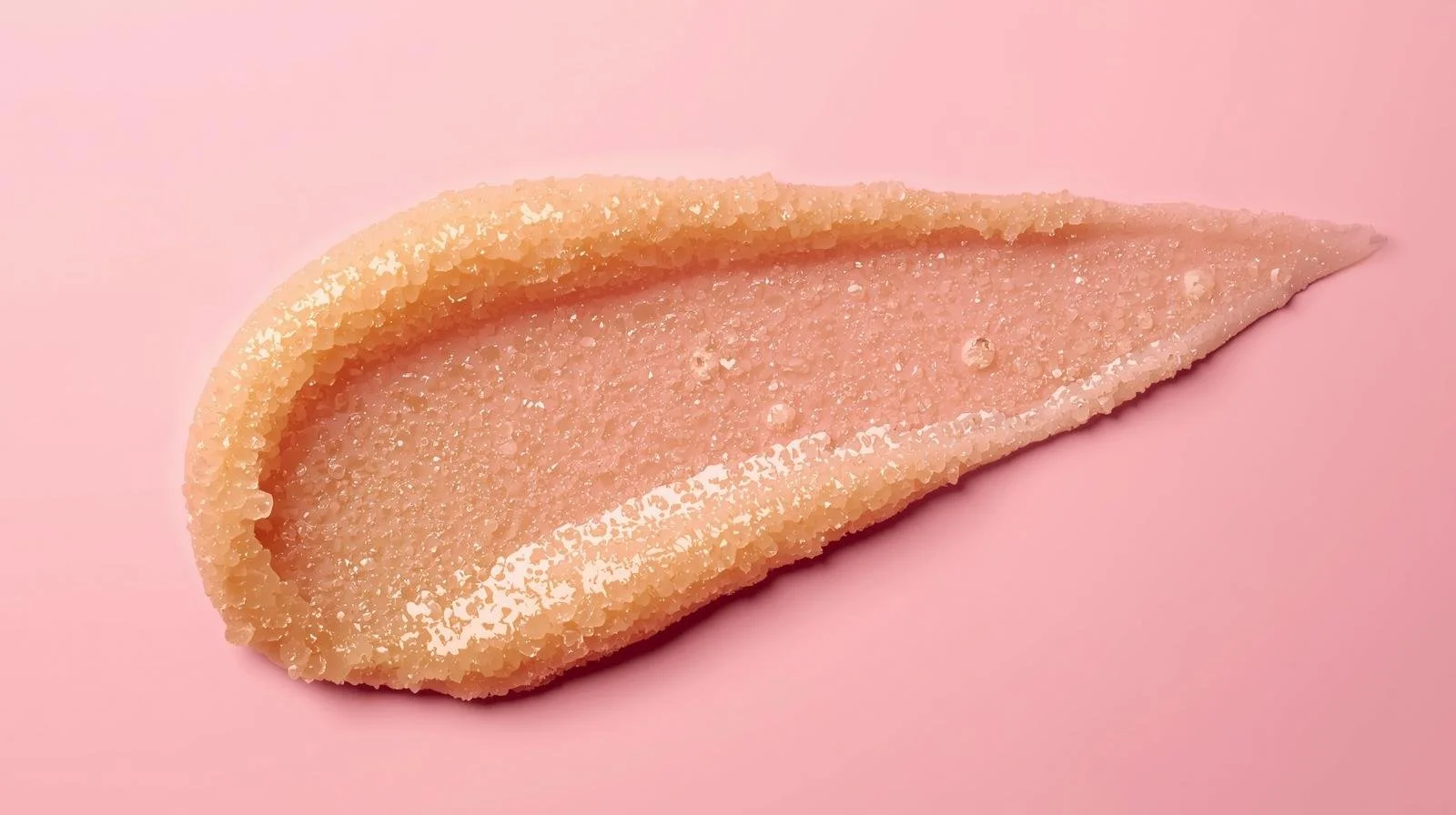 tan sugar scrub smeared pink background.jpg