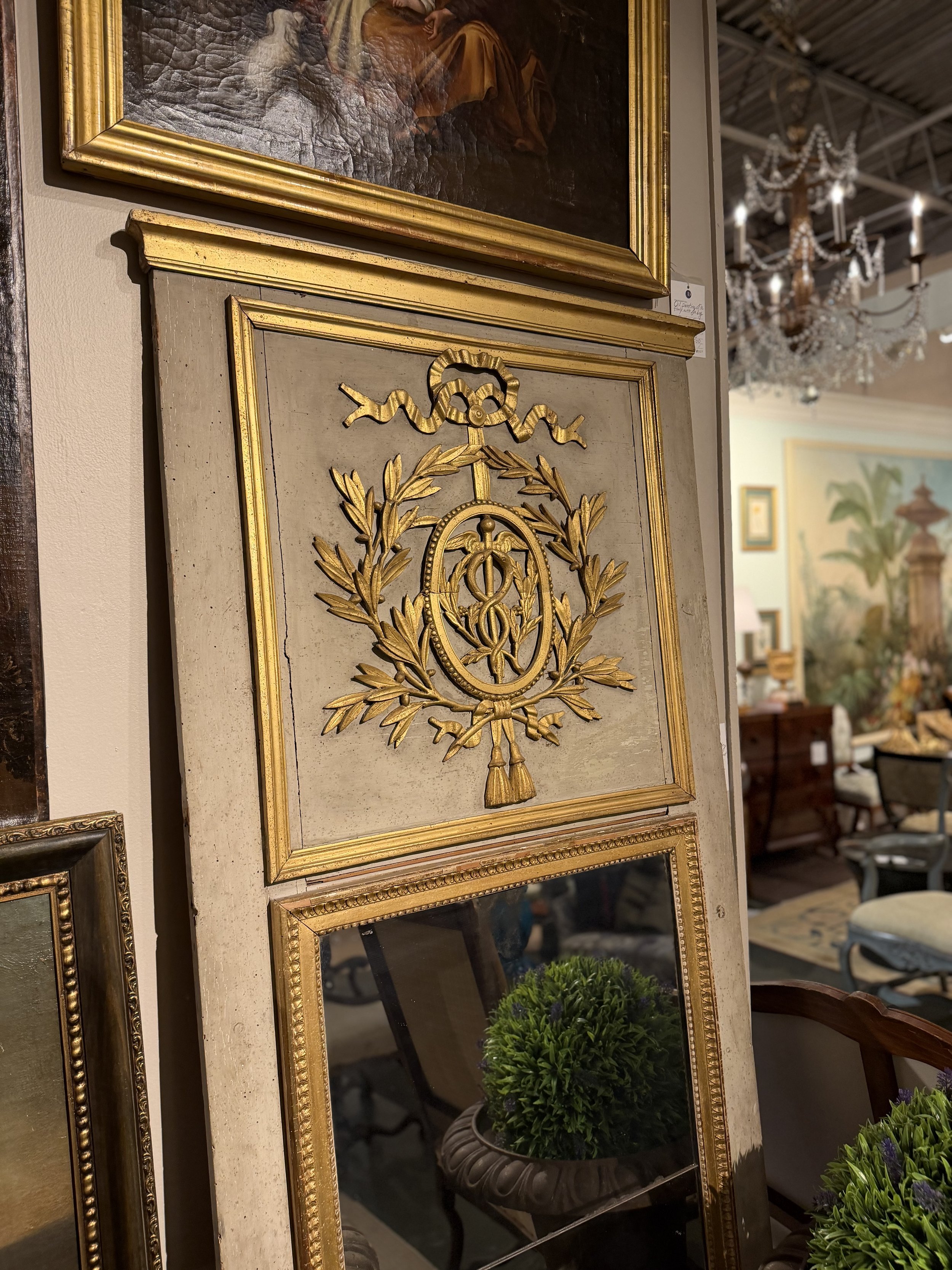 French 18th century trumeau mirror with carved harvest detail.  81" h x 33" w