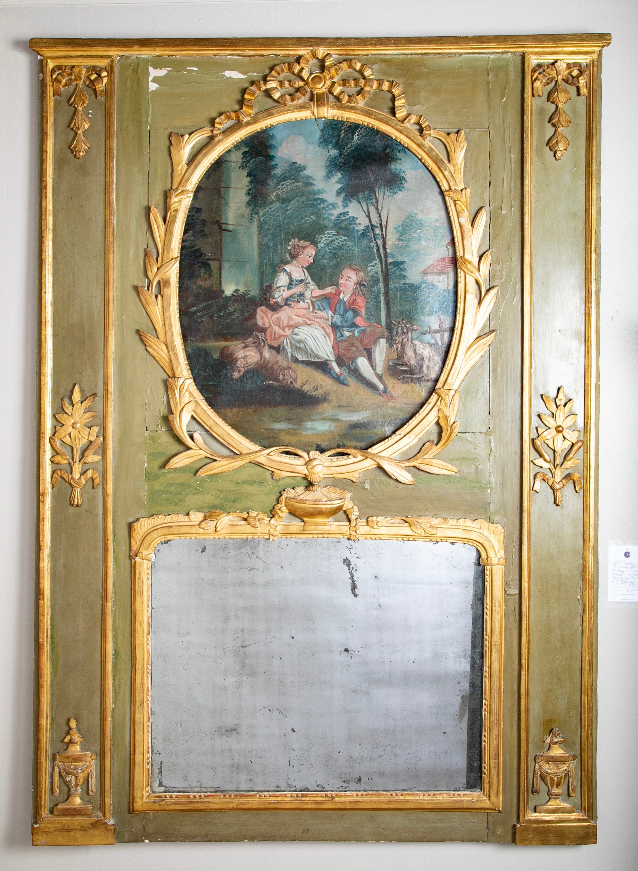 An 18th century French tremeau with a romantic scene of a man and woman in a forest.  Circa 1770.  54" h x 45" w 