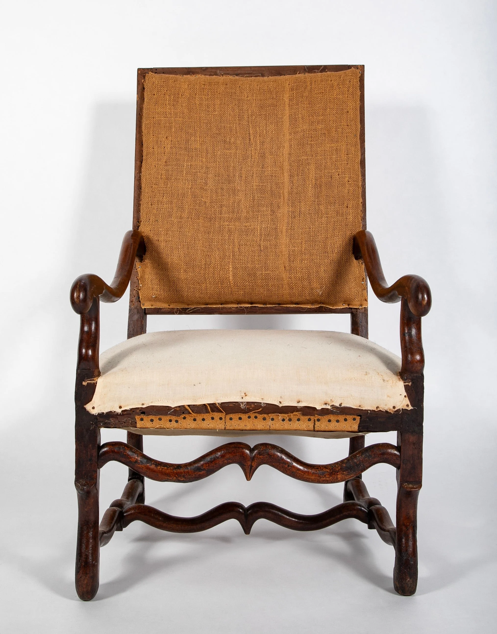 Pair of Louis XIII Style Fauteuils Noyer Provencal upholstered in beige linen.  18th century.  45" h x 25" w x 24" d 