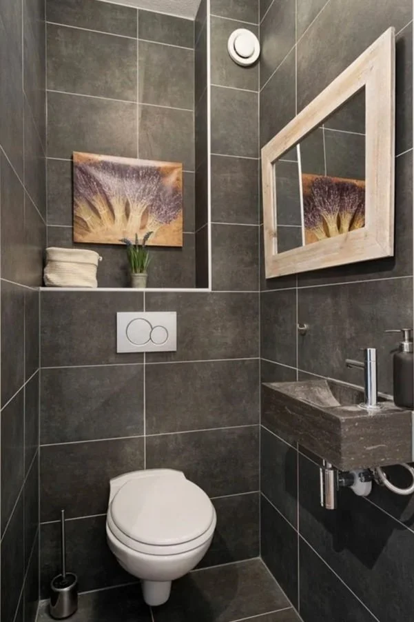 Modern outdoor living space with a swimming pool, lounge chairs, umbrella, and a seating area with cushions and a coffee table.