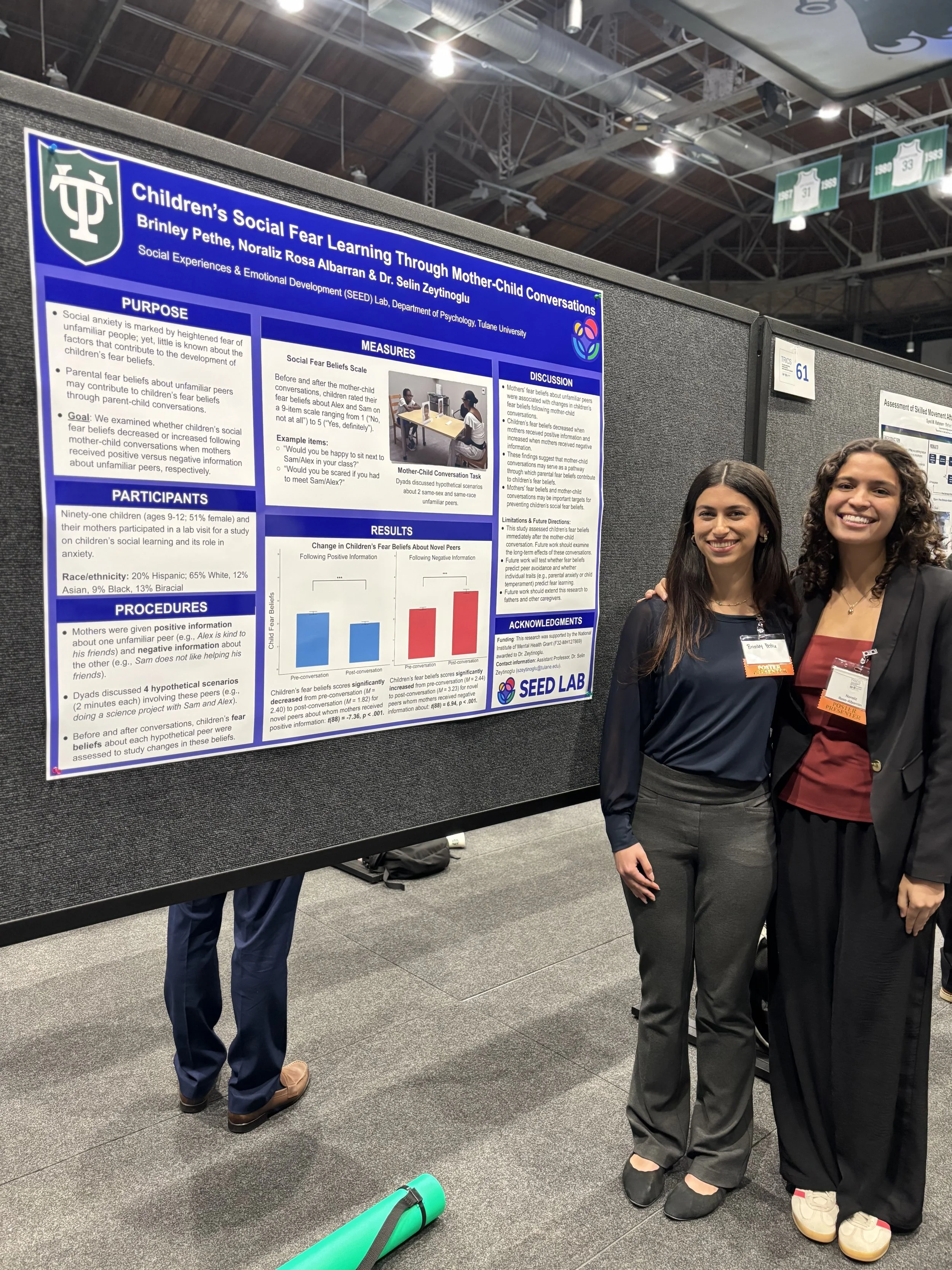 SEED Lab undergrads, Brinley Pethe & Noraliz Albarran Rosa standing by their poster