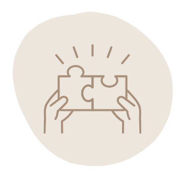 Two hands holding and connecting two puzzle pieces