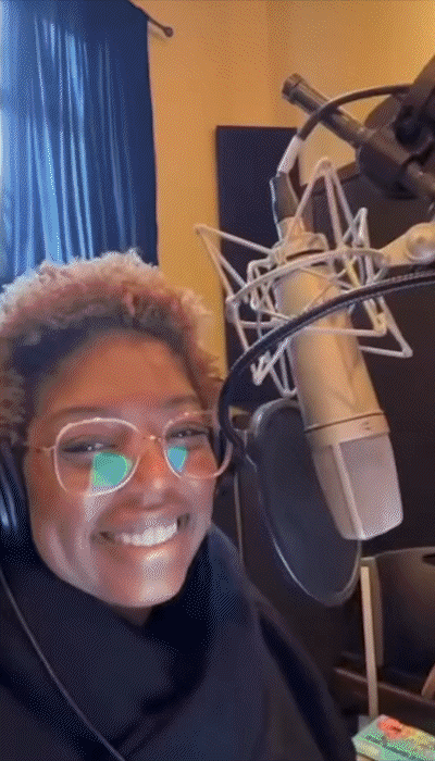 A fun Black woman with short hair in short snippets of video talking into a mic and making funny faces