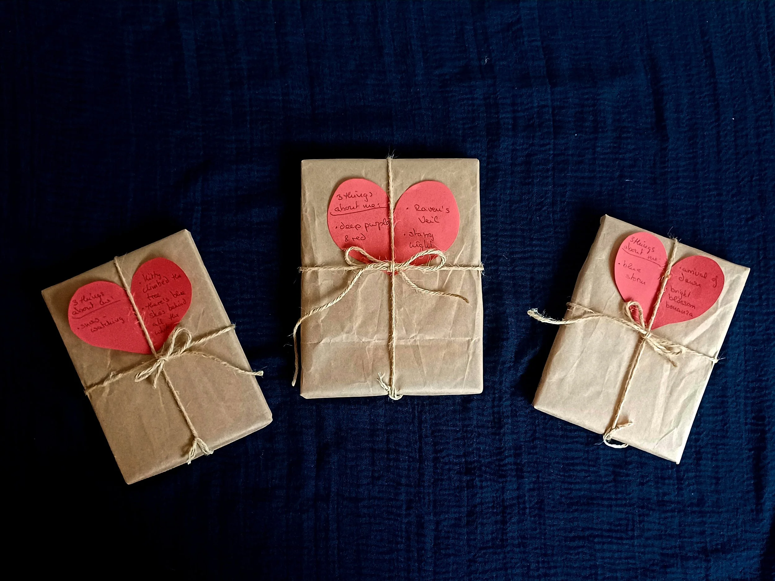 parcels wrapped in kraft paper with a red heart