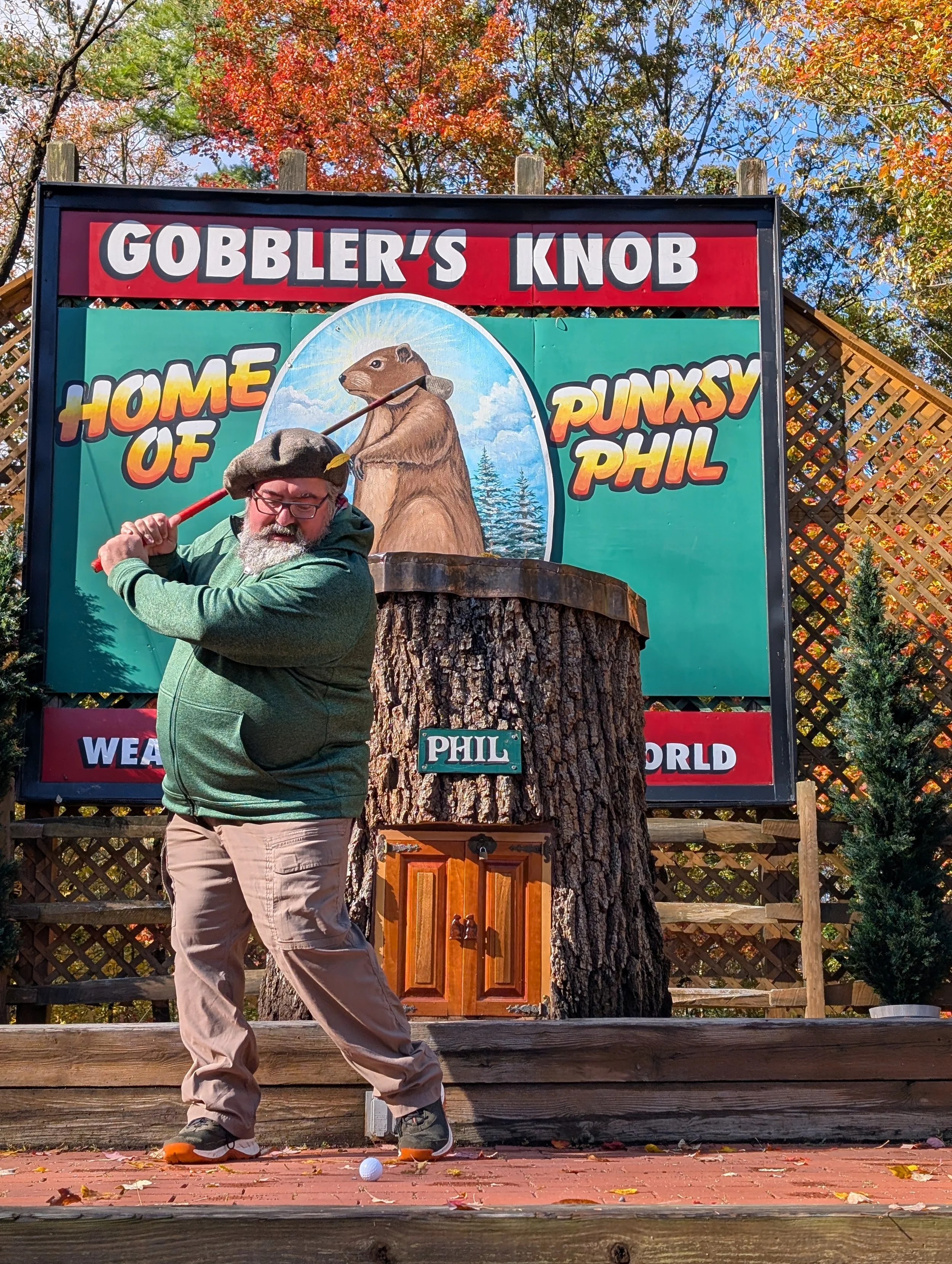 A golfer playing with a Groundhog Hickory Golf hickory golf club