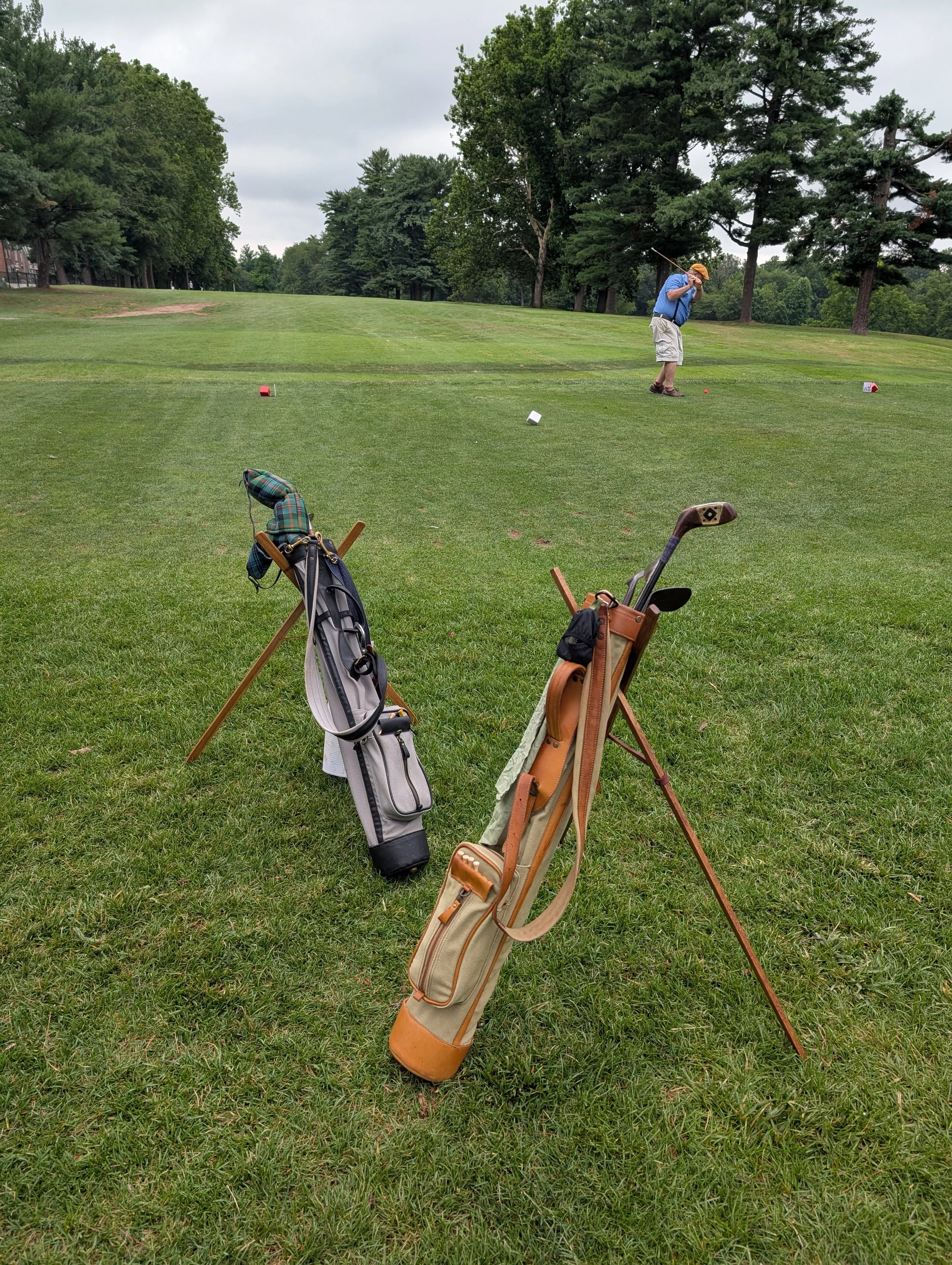 A golfer playing with a Groundhog Hickory Golf hickory golf club