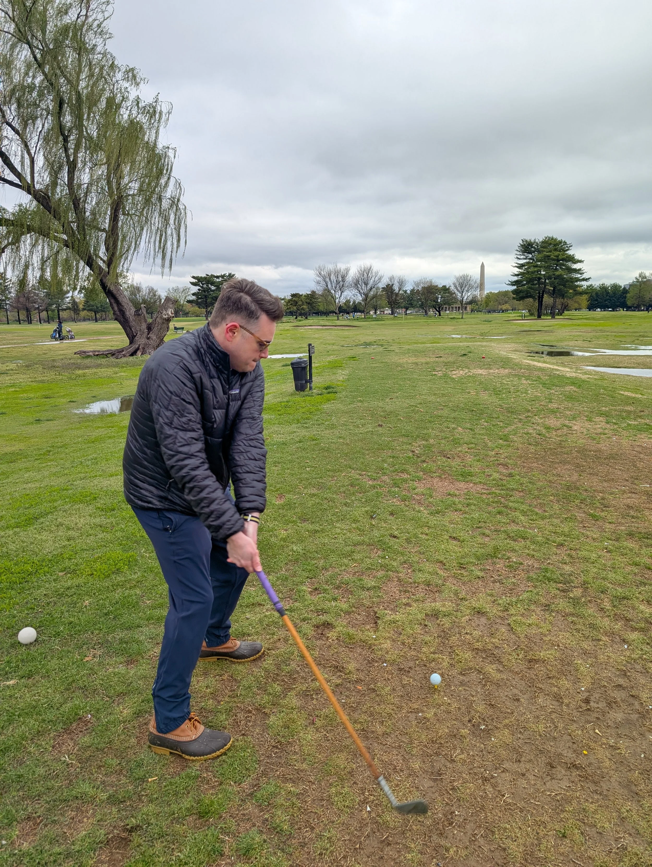 A golfer playing with a Groundhog Hickory Golf hickory golf club