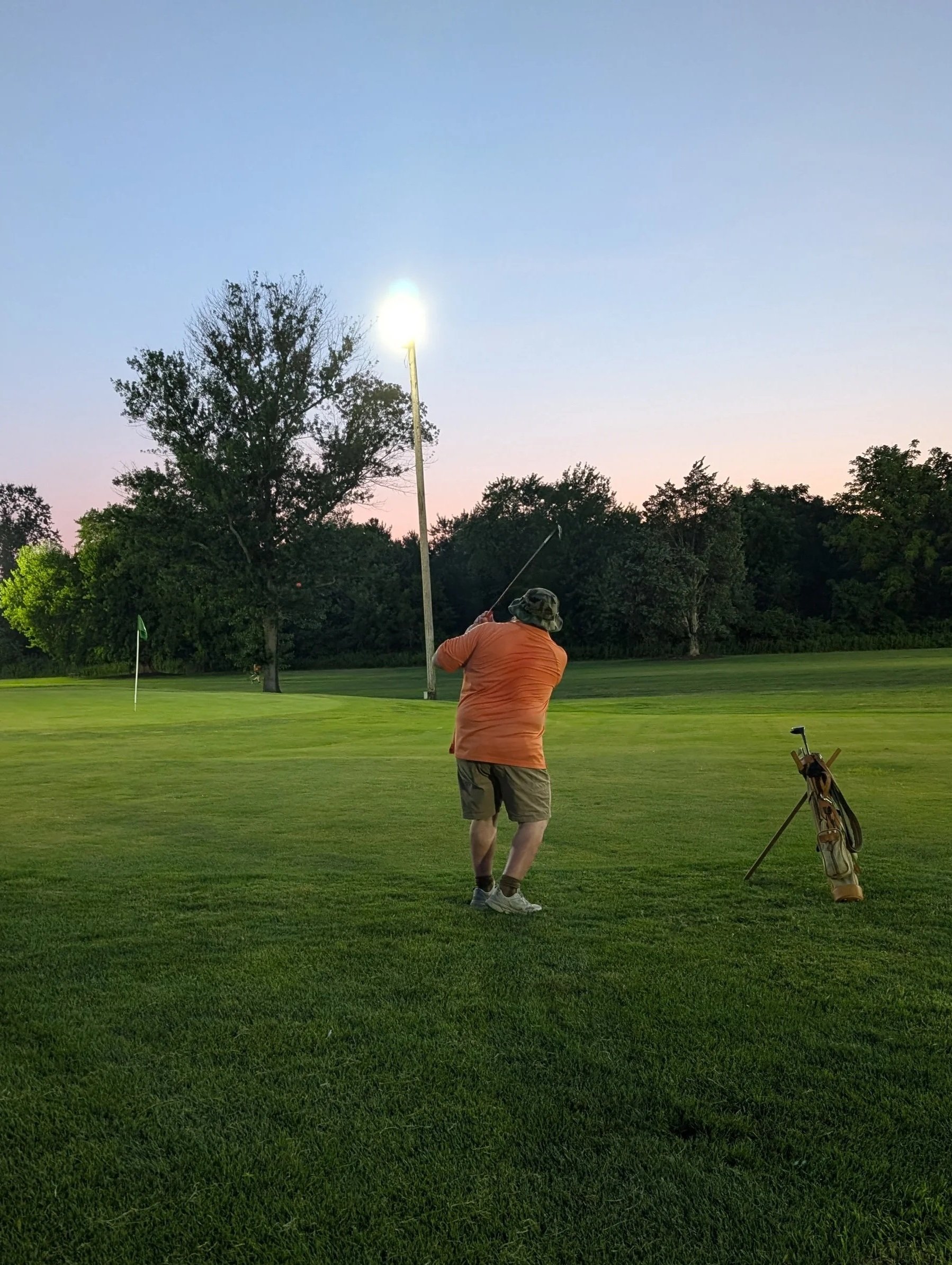 A golfer playing with a Groundhog Hickory Golf hickory golf club