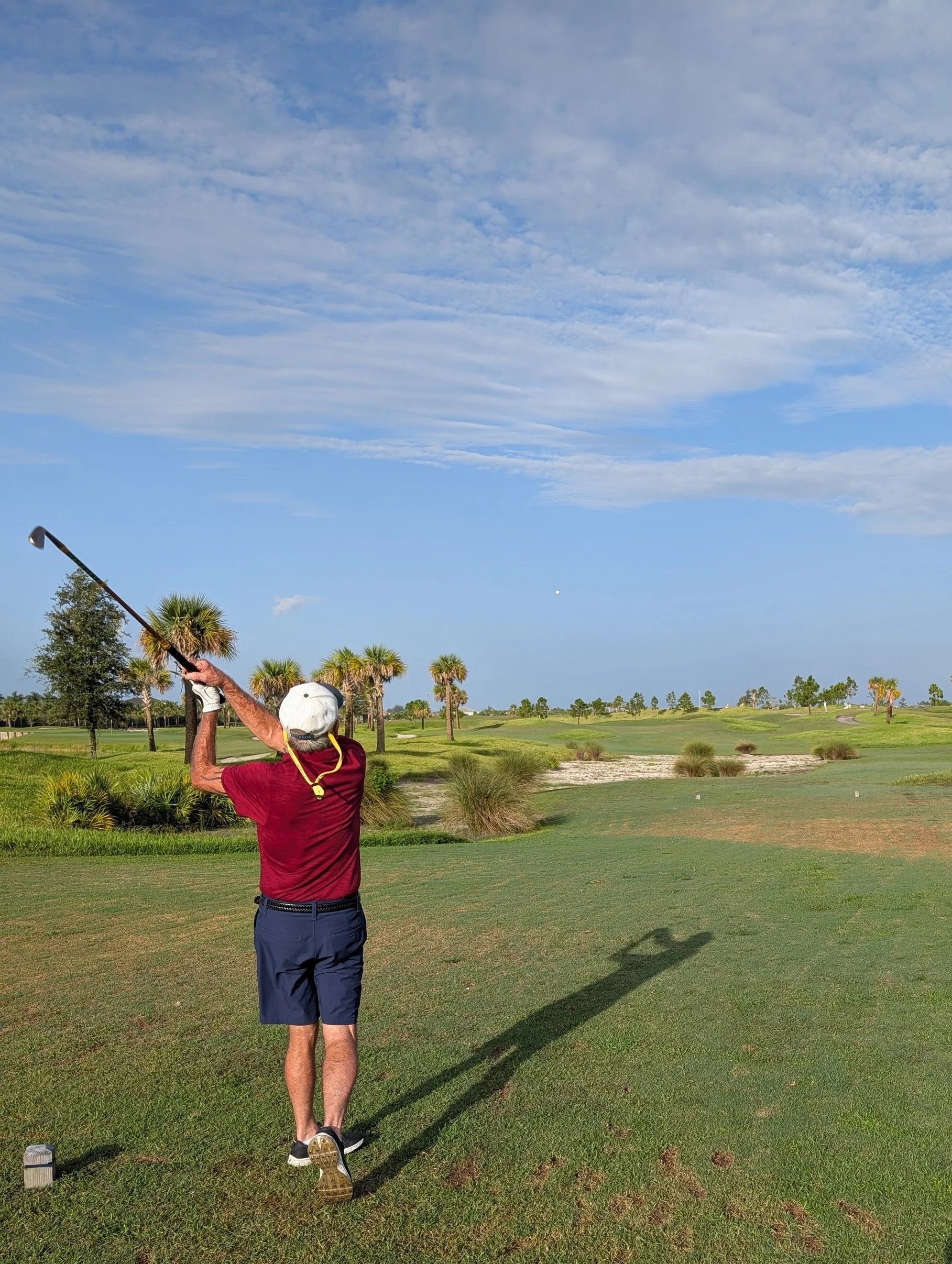 A golfer playing with a Groundhog Hickory Golf hickory golf club