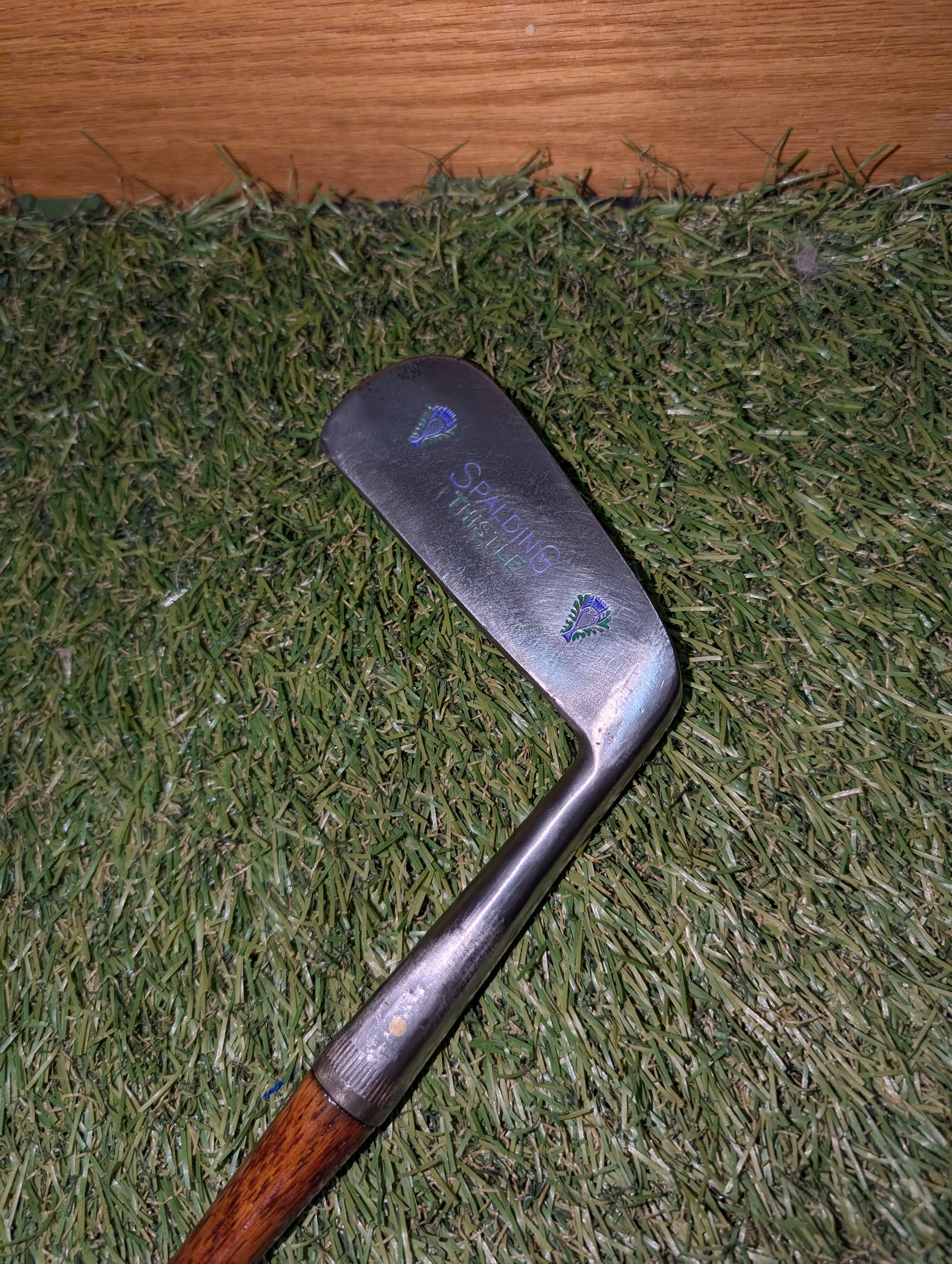 Hickory golf club putter in the colors of Scottish thistle