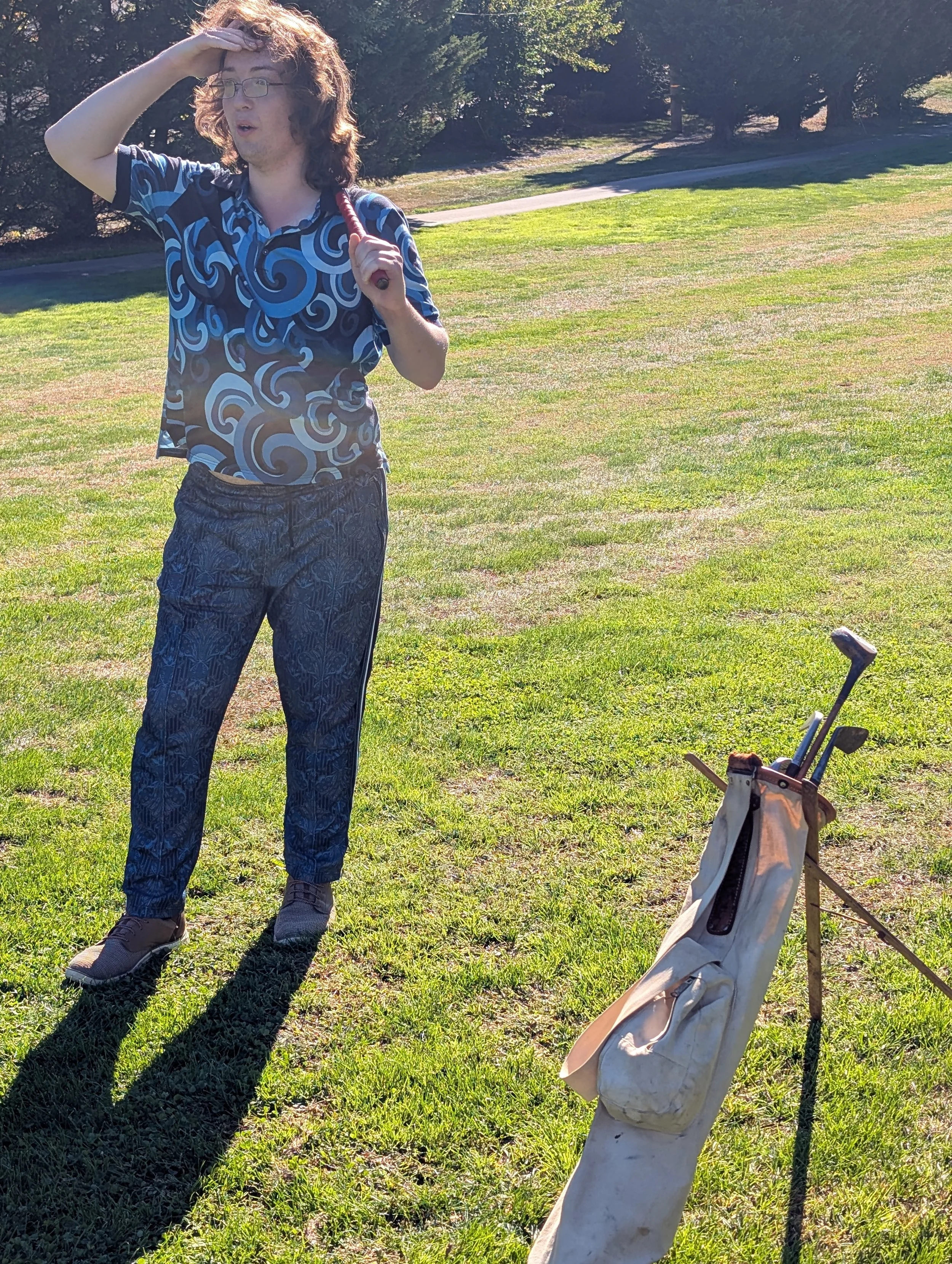 A golfer playing with a Groundhog Hickory Golf hickory golf club