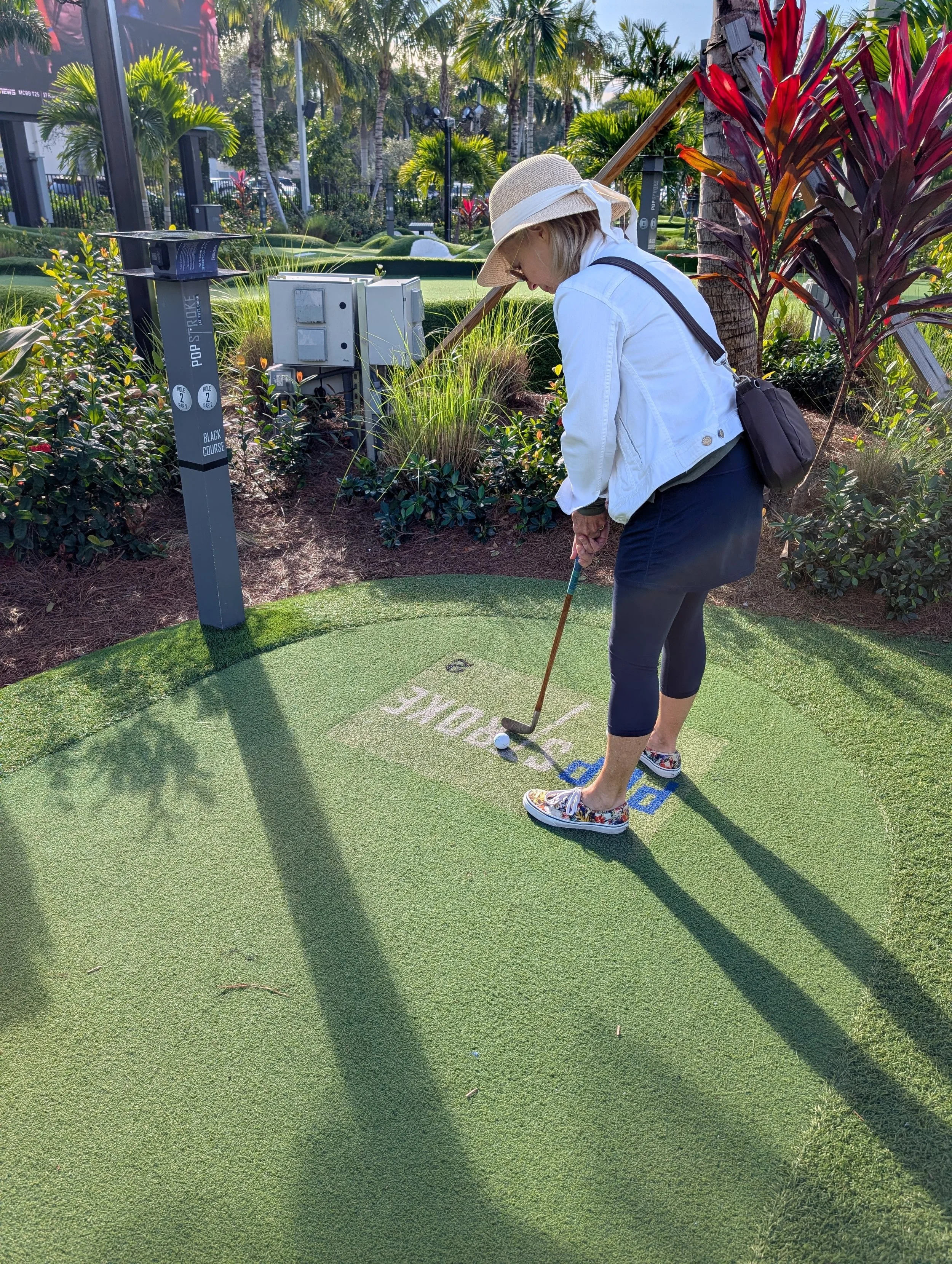 A golfer playing with a Groundhog Hickory Golf hickory golf club