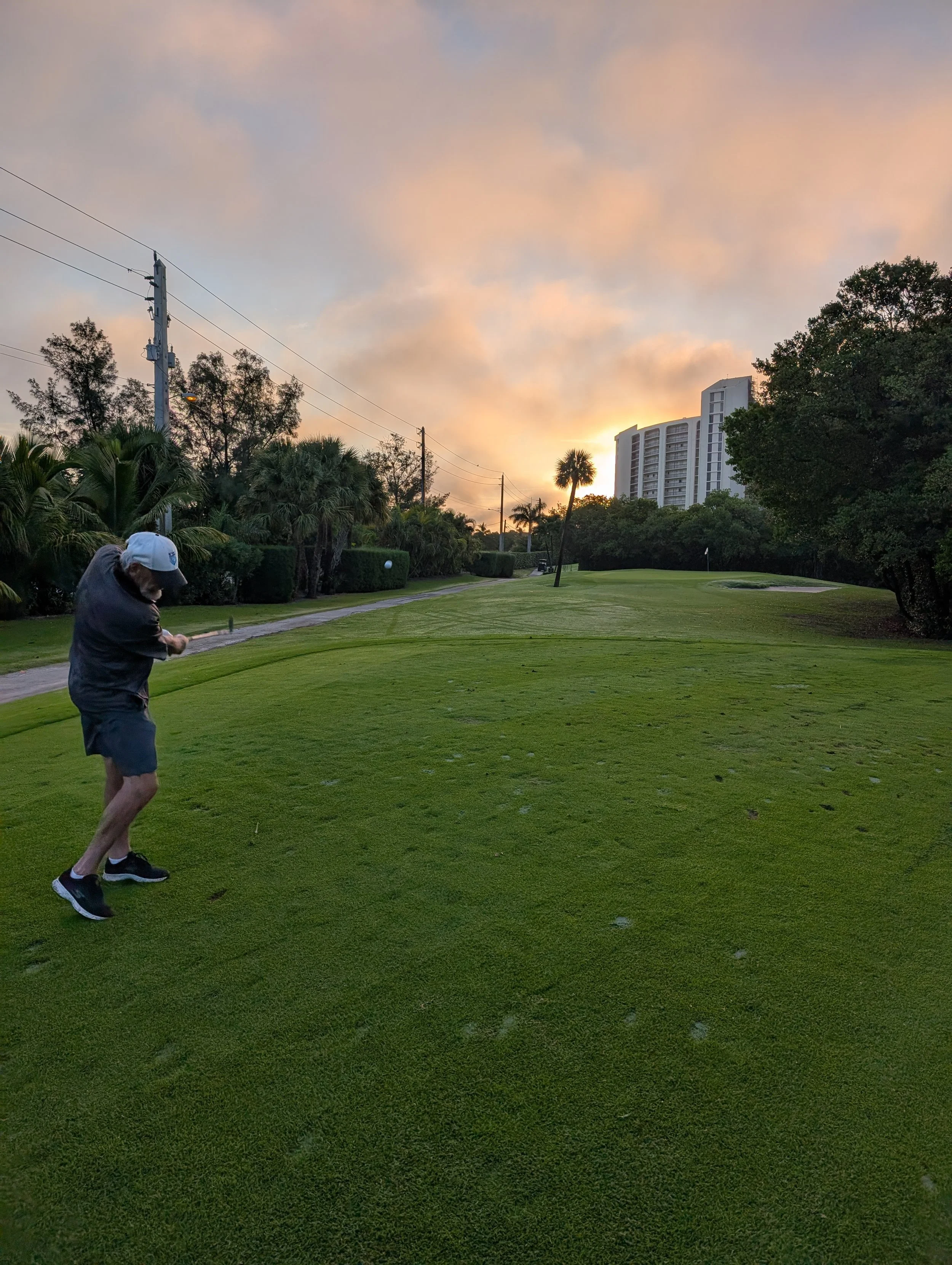 A golfer playing with a Groundhog Hickory Golf hickory golf club