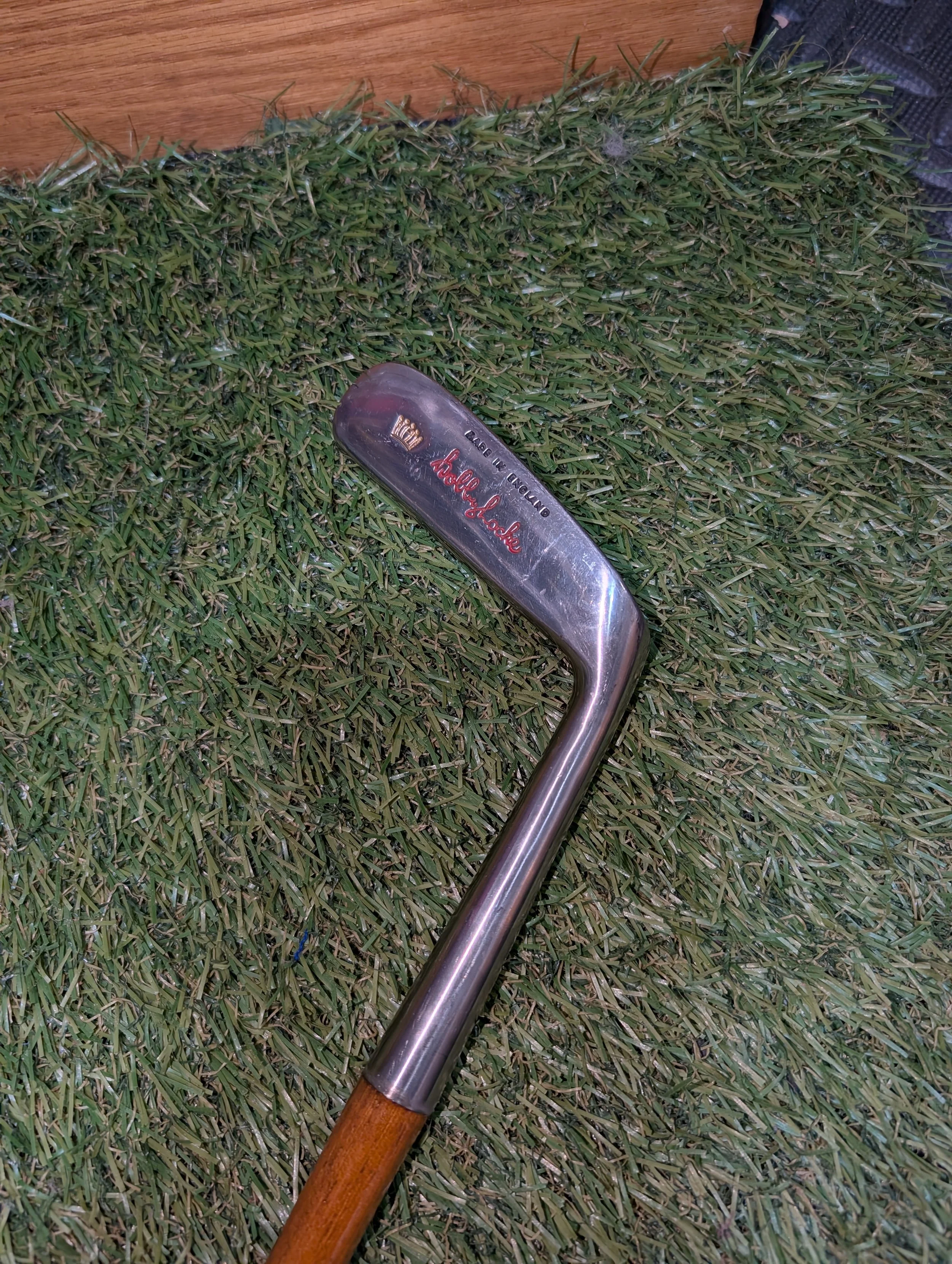 Hickory golf club putter named for Bobby Locke with red and black colors