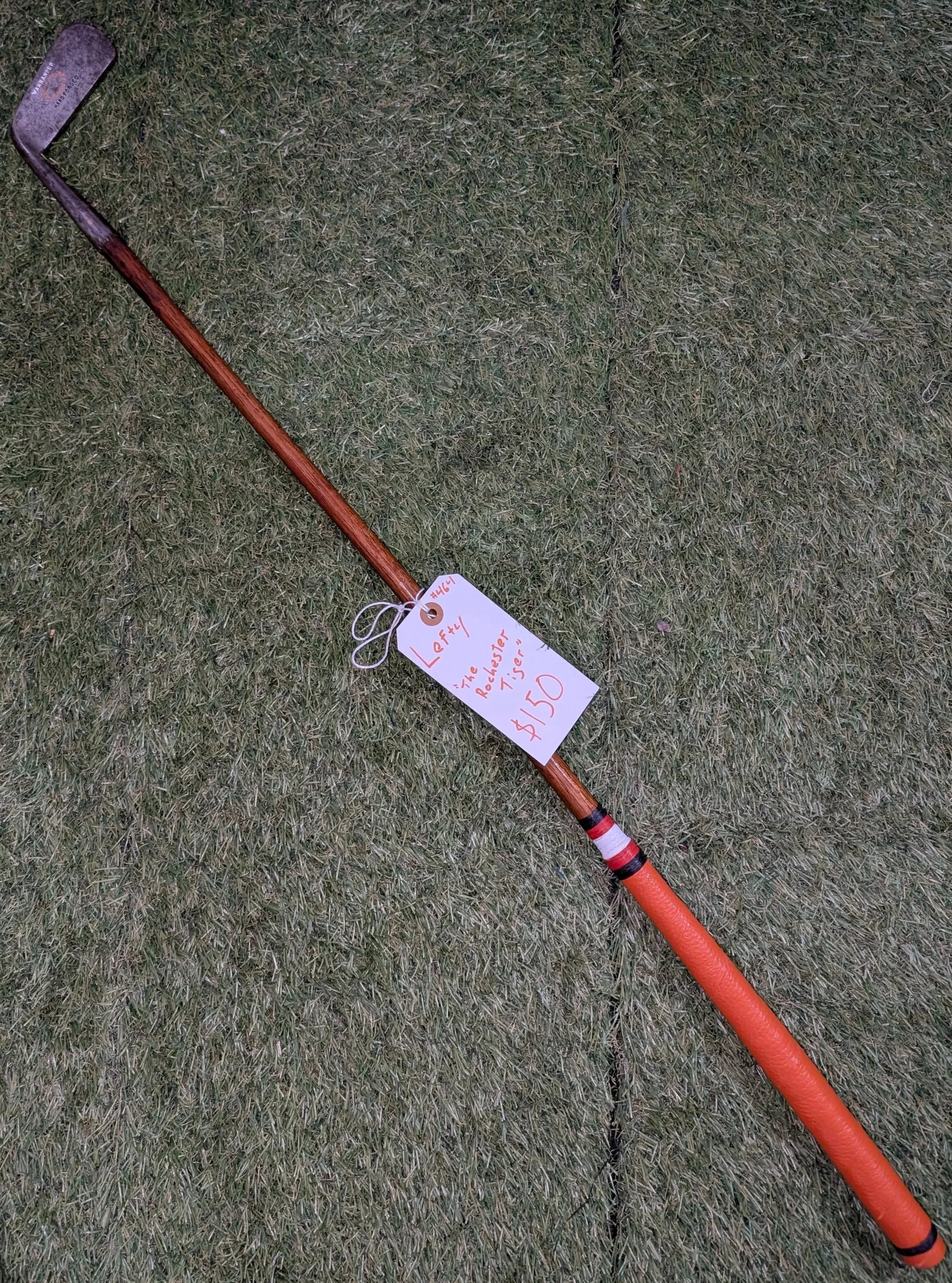 Left handed hickory golf club putter in the colors of the RIT Tigers