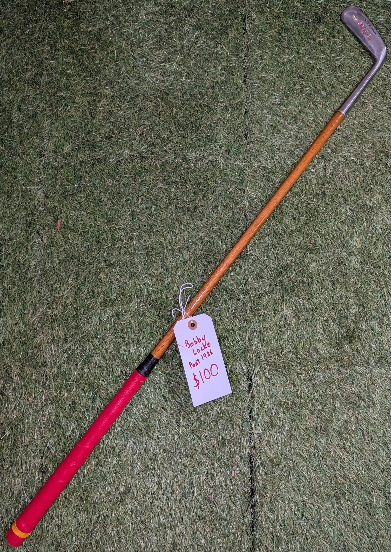 Hickory golf club putter named for Bobby Locke with red and black colors
