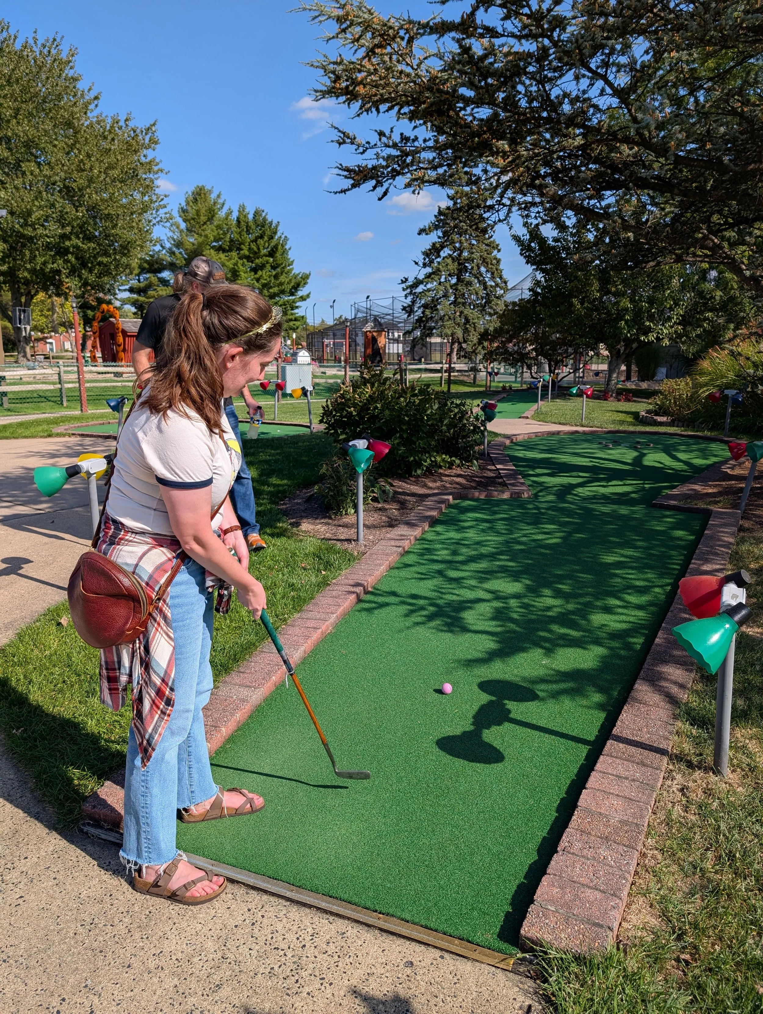 A golfer playing with a Groundhog Hickory Golf hickory golf club