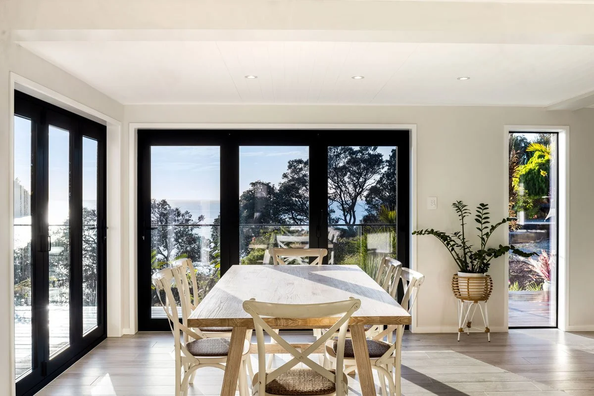 Open-plan dining space with bush outlook and seamless access to renovated deck