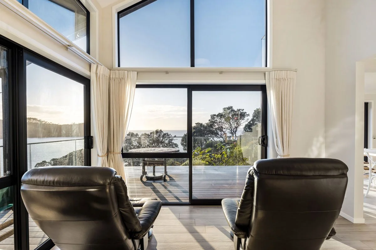 Kitchen and dining extension filled with natural light and coastal views, part of full renovation