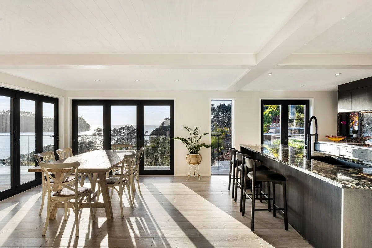 Kitchen extension with full-height glazing and indoor-outdoor connection in Hatfields Beach coastal renovation