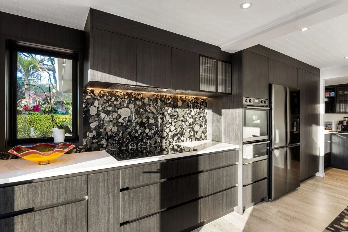 Modern dark kitchen with matching terrazzo island, upgraded by Ze Build in North Auckland