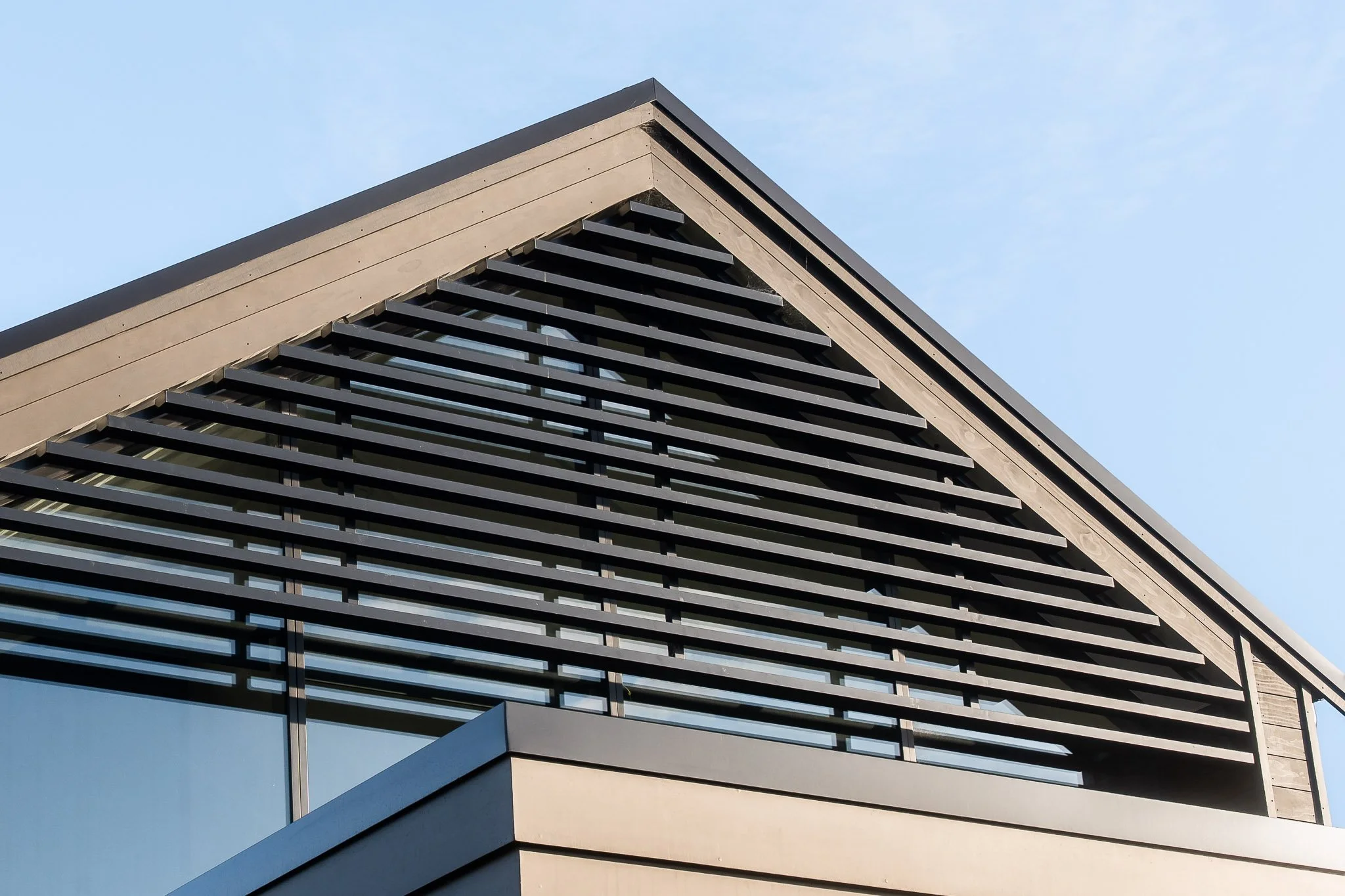 Decking and cladding junction showing off precise detailing and craftsmanship.