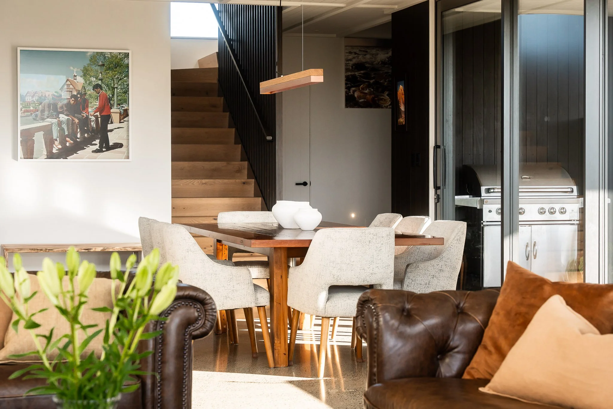 Custom built-in furniture echoing timber theme and bringing design continuity.