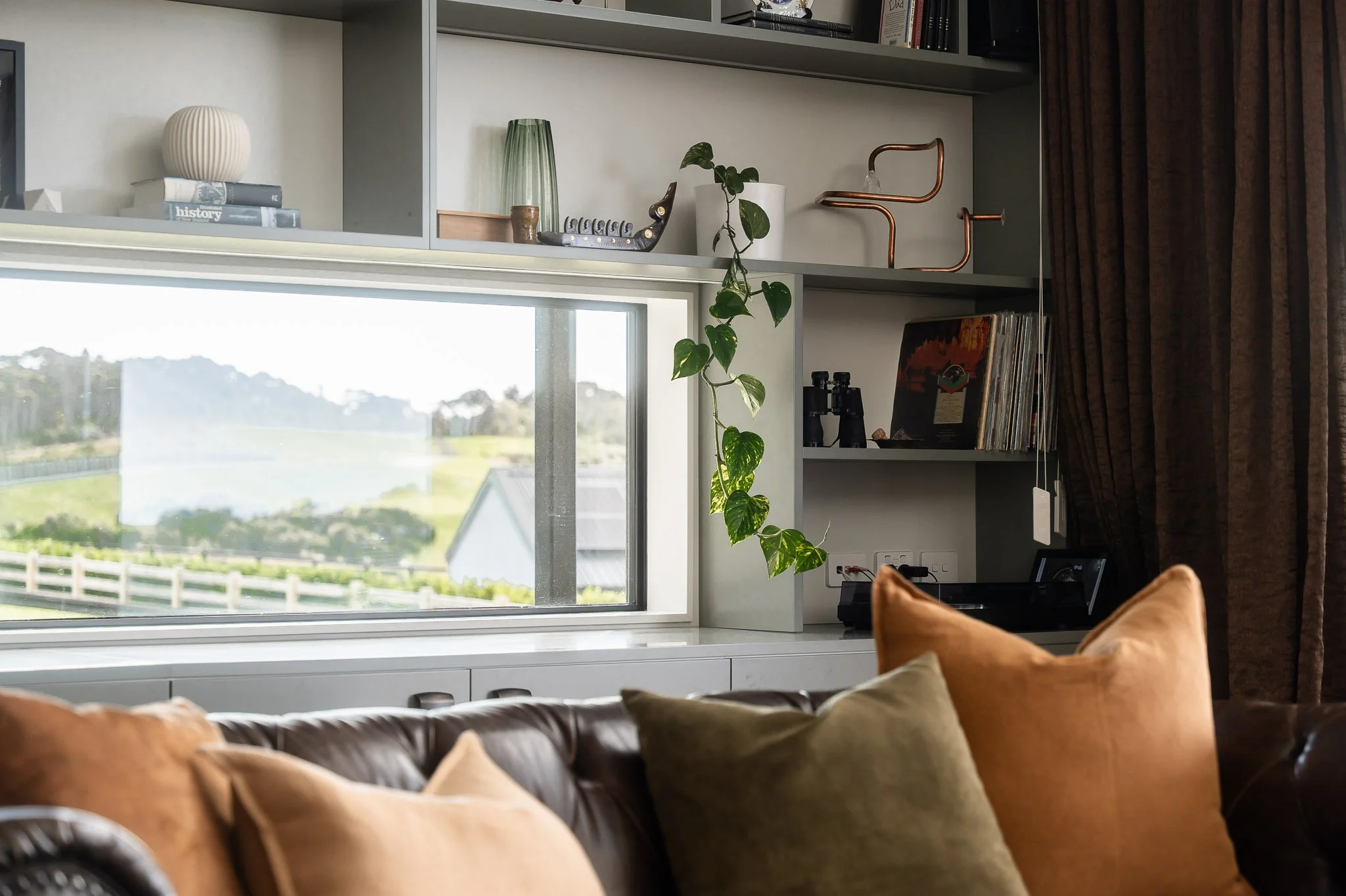 Evening light filters through louvres, adding ambience to covered terrace space.