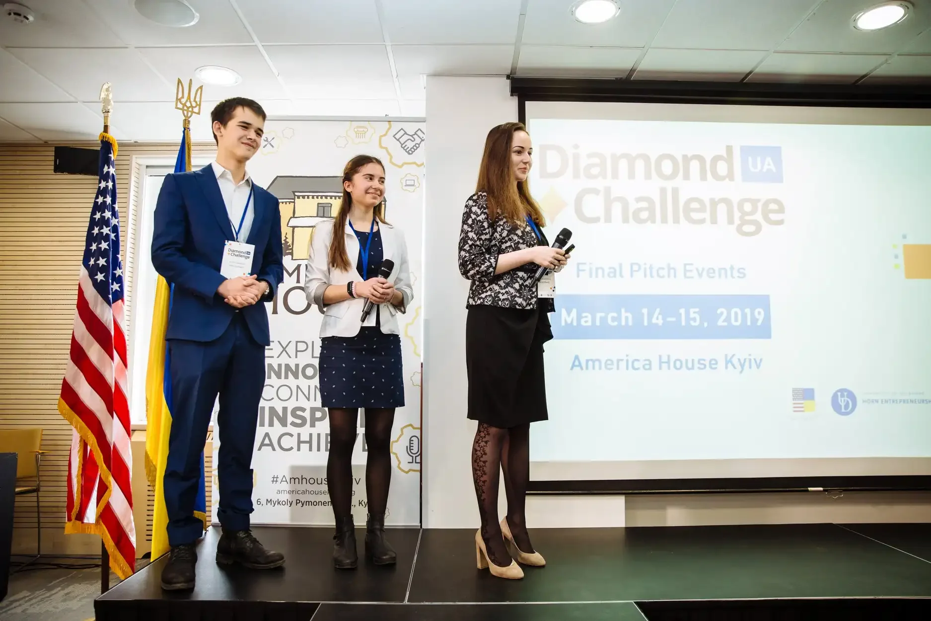 High school students presenting a startup project to a panel of judges following the Diamond Challenge rubric criteria.