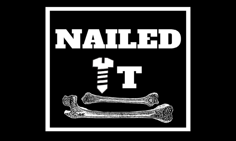 A black and white graphic with the word 'NAILED' at the top, a hammer, a T-shaped nail, and two bones at the bottom.