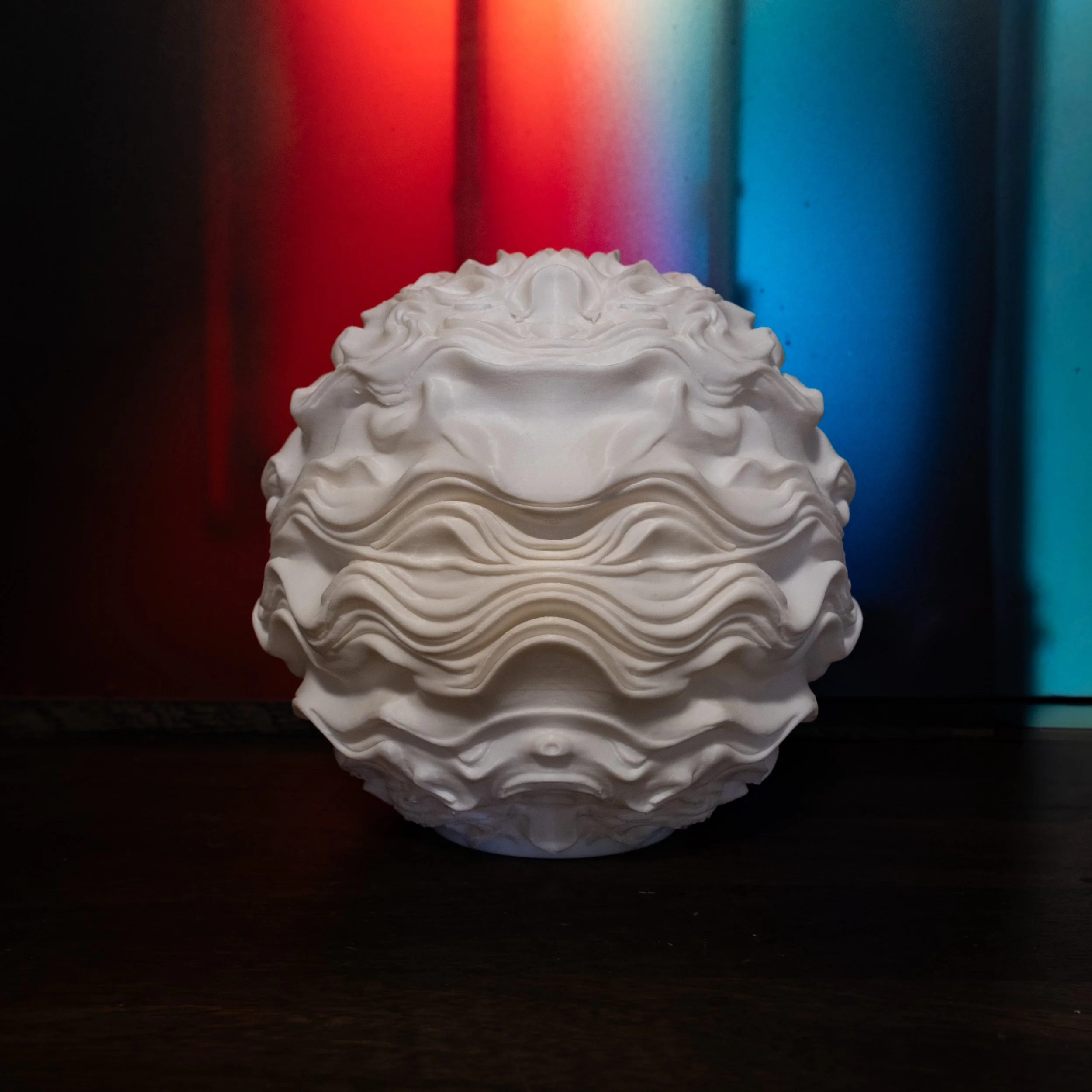 Syzygy resting within an interior setting, creating a calm, ambient presence.