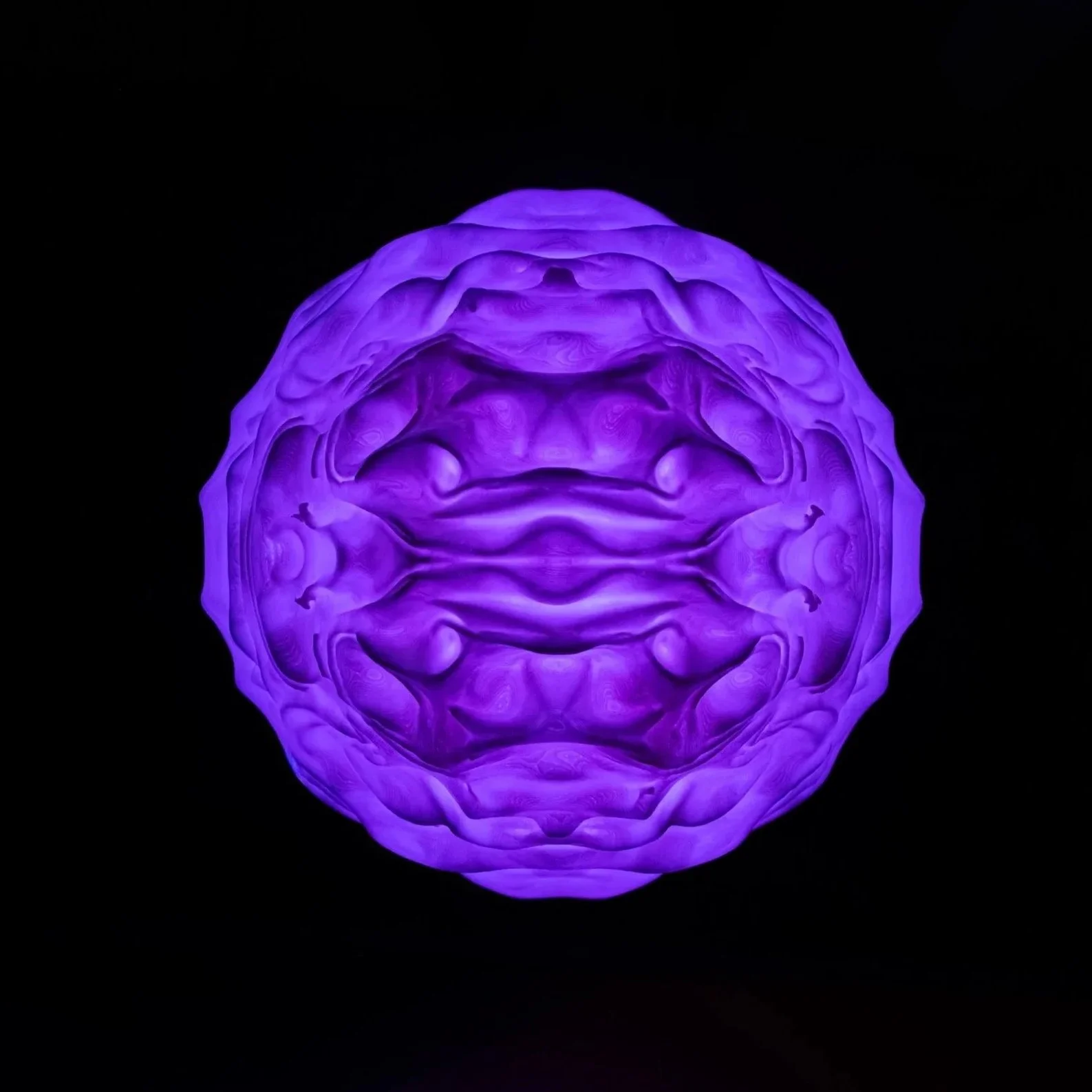 Detail of the Syzygy lamp surface and form, highlighting restrained design and proportion.