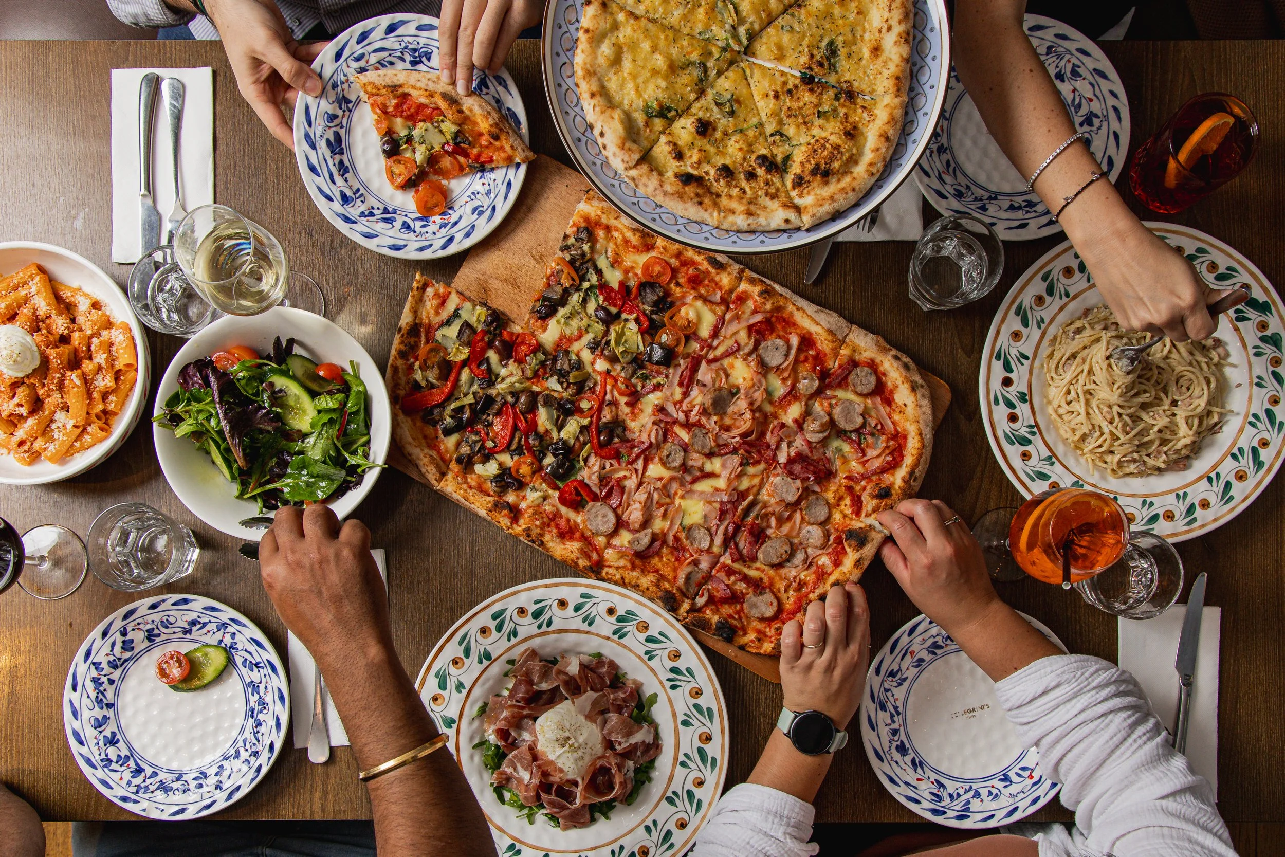 Group dining experience with pasta, pizza and wine at Pellegrini’s Chatswood
