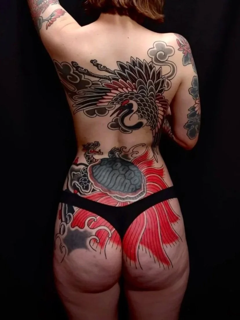 female backpiece tattoo