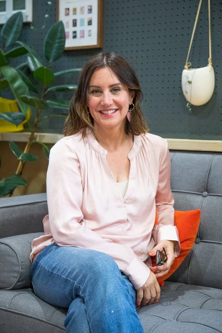Kate Baily smiling in a relaxing space