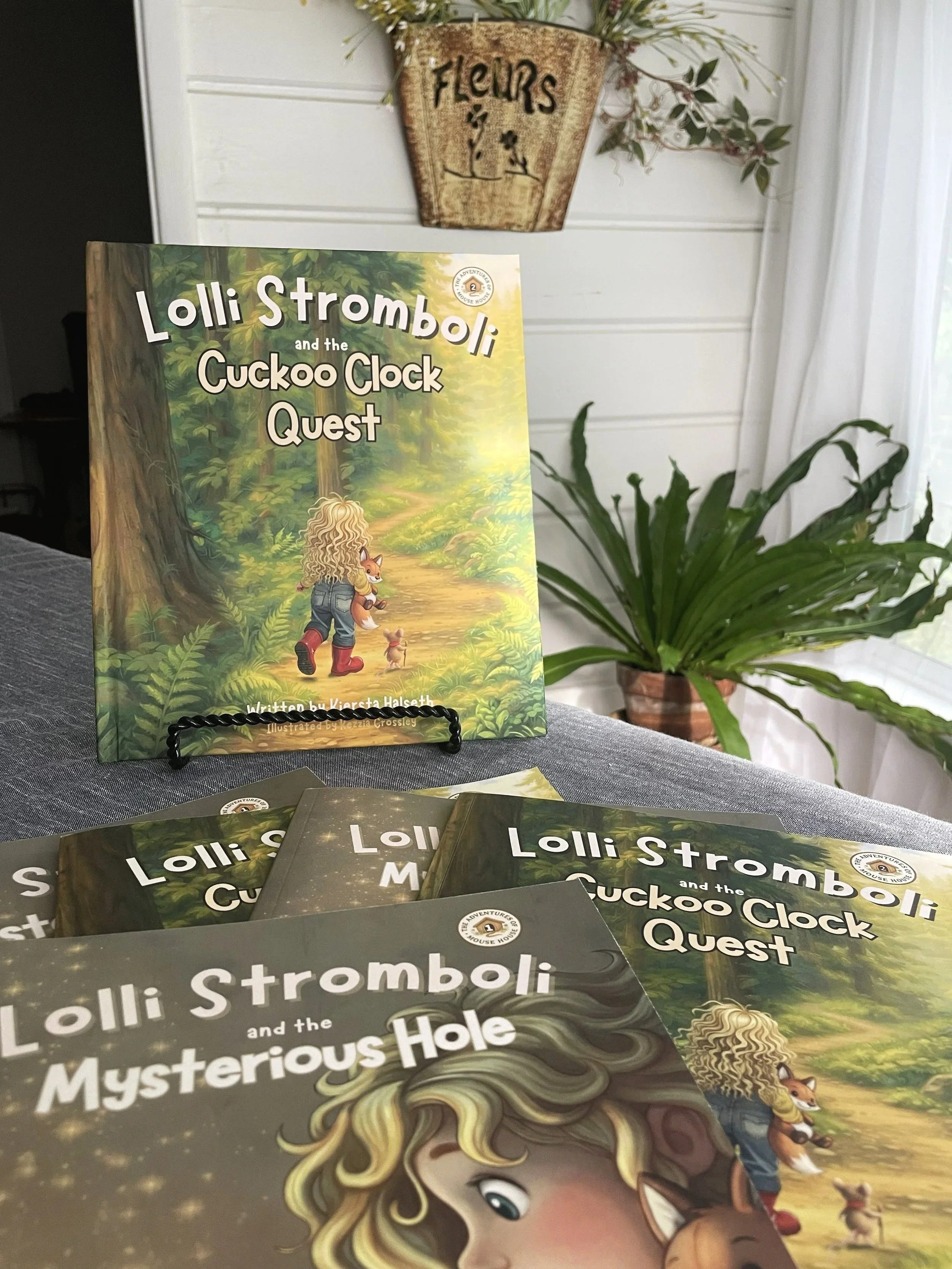 Display of Nighttype Books children's titles, including Lolli Stromboli and the Cuckoo Clock Quest, available for school, library, and bookstore collections.