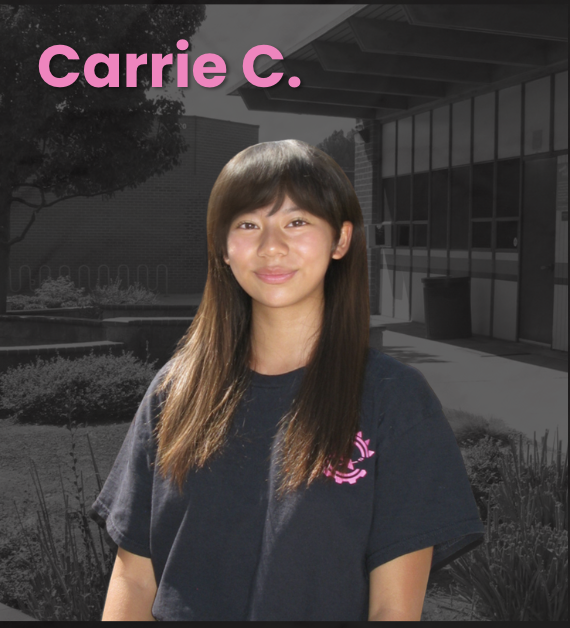 Young woman with long brown hair smiling, wearing a navy t-shirt with pink logo, standing outside a modern building with large windows, trees, and landscaping in the background, with her name 'Carrie C.' in pink text at the top.