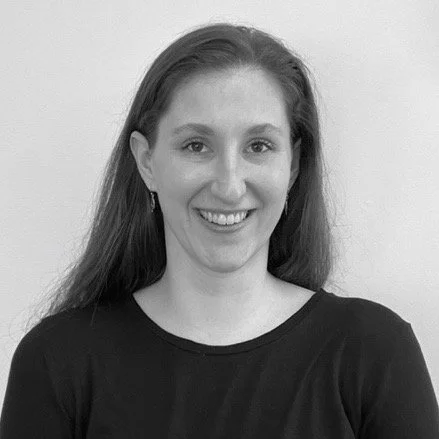 Black and white headshot of woman smiling